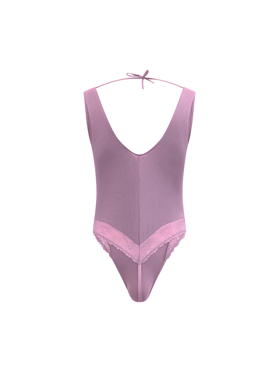 Rear view of purple XDress men's lingerie on a white background.