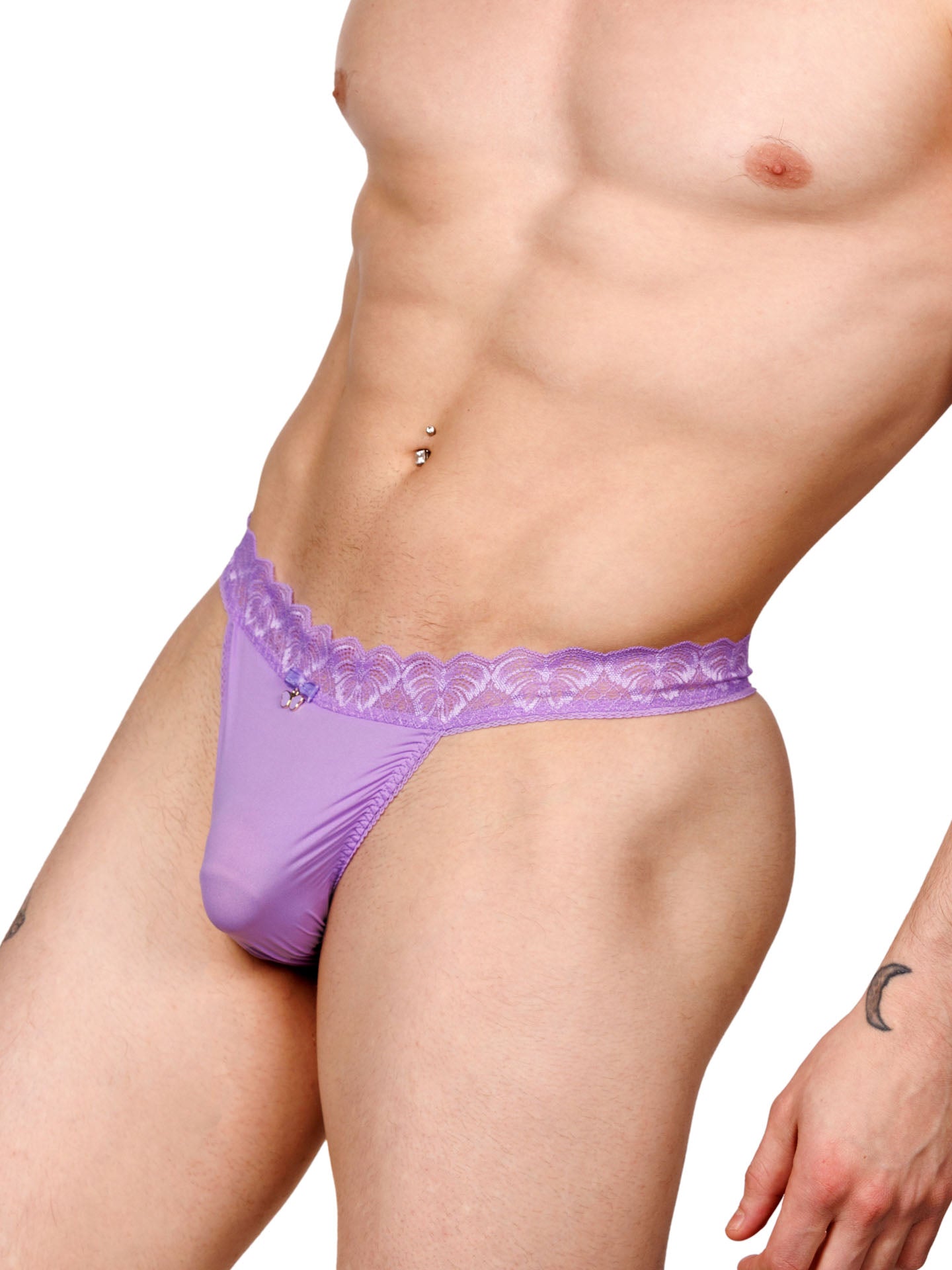 Male model wearing a purple men's thong with a lace waistband and metallic charm at the front, shown from the side.