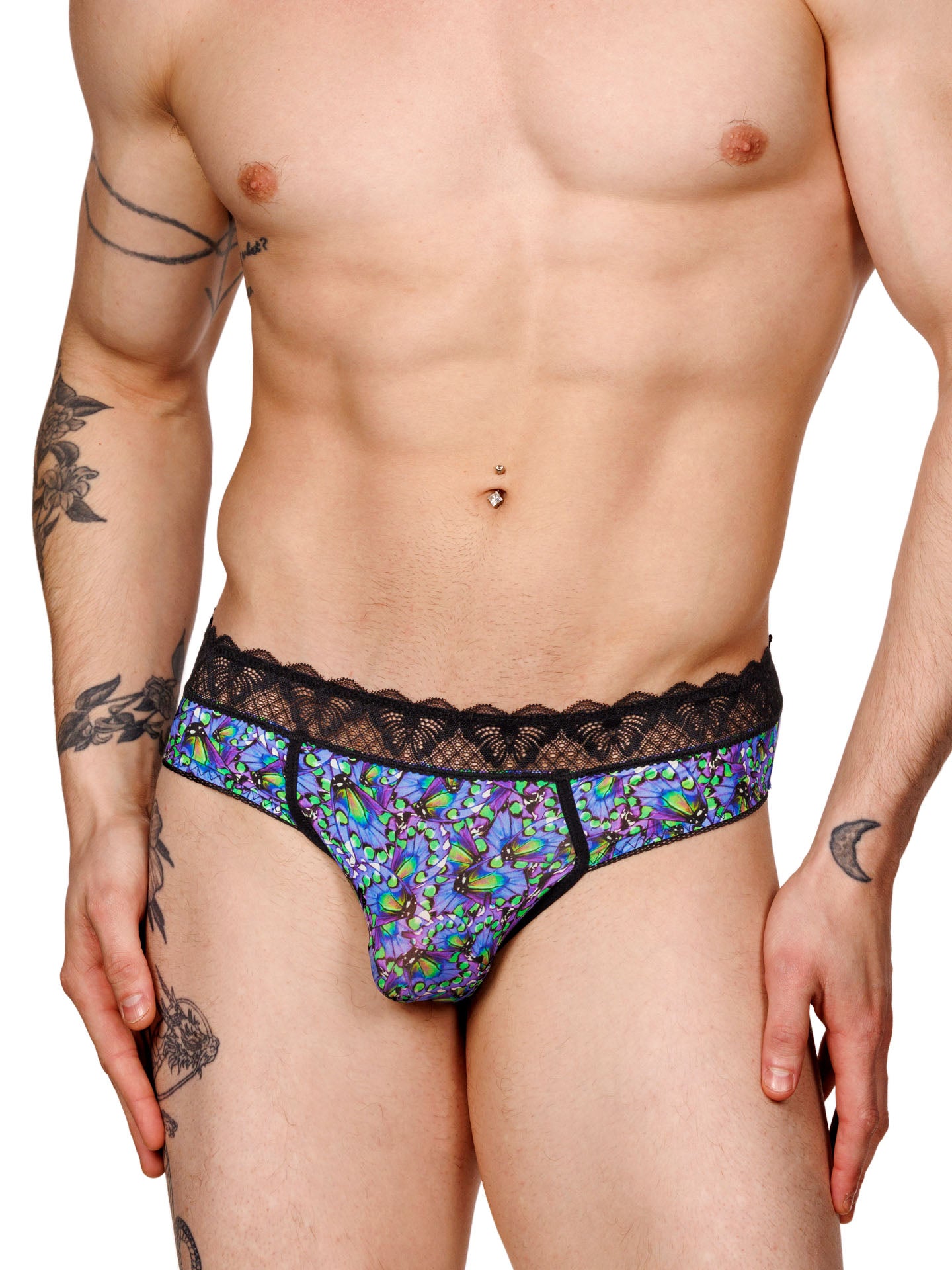 Male model wearing a blue floral print XDress men's panty with a black lace waistband, shown from the front.