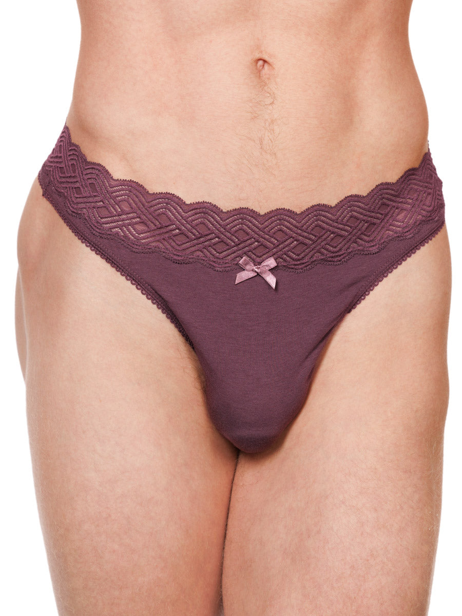 Closeup view of a male model wearing a burgundy red XDress cotton thong with a matching lace waistband