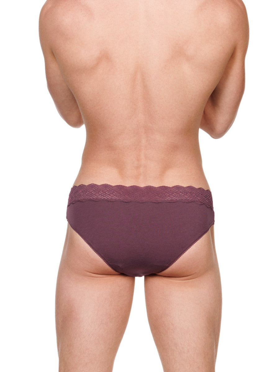 Back view of a male model wearing burgundy red XDress cotton panties with a lace waistband