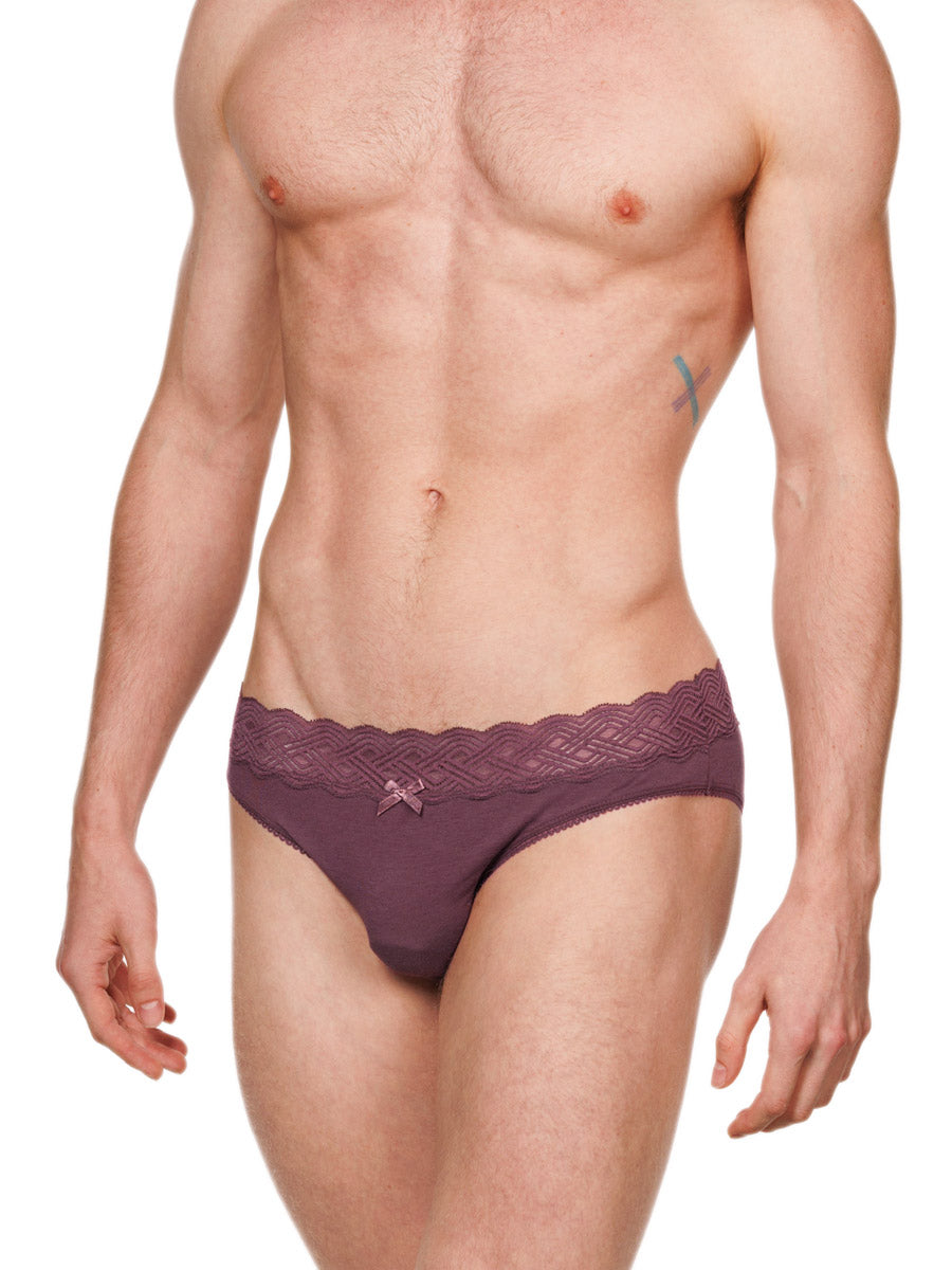 Side view of a male model wearing burgundy red XDress cotton panties with a lace waistband