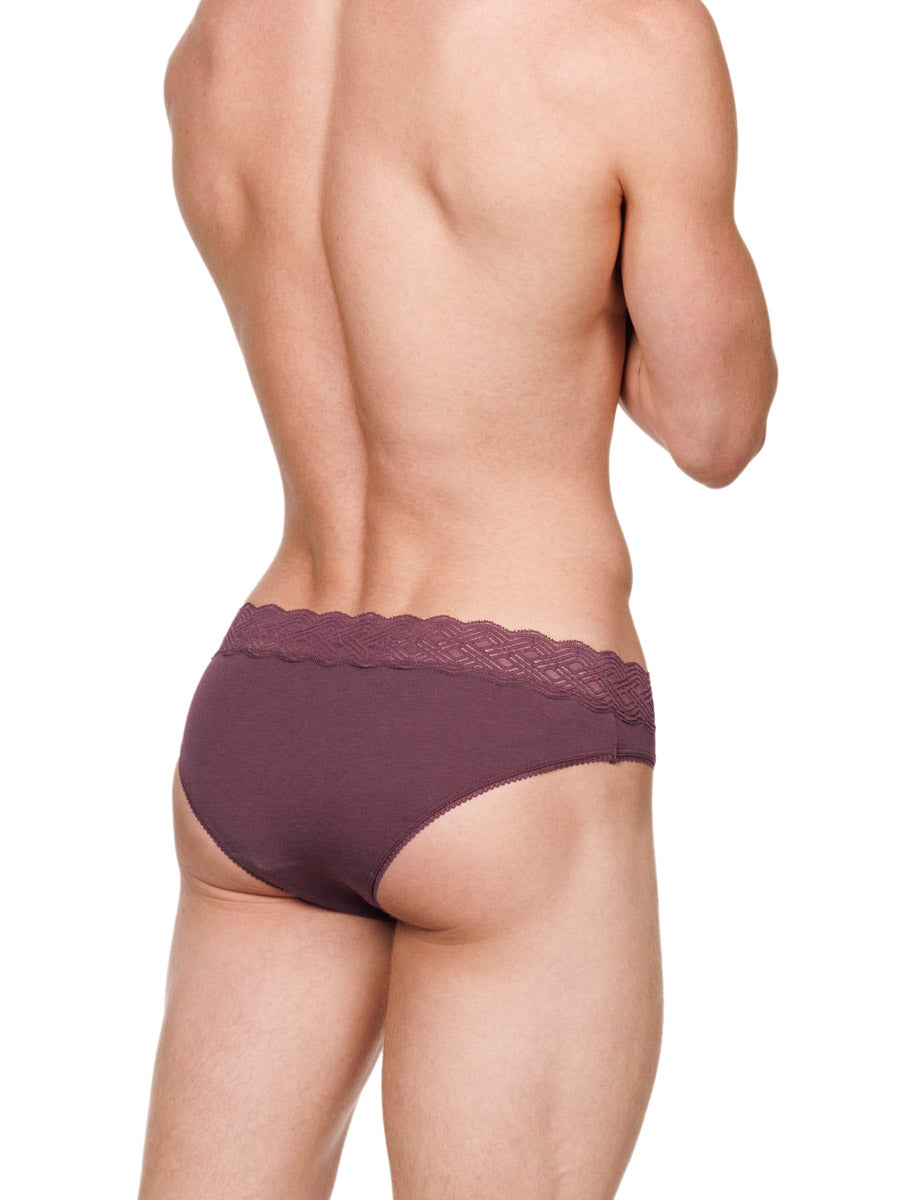 Side view of a male model wearing burgundy red XDress cotton panties with a lace waistband