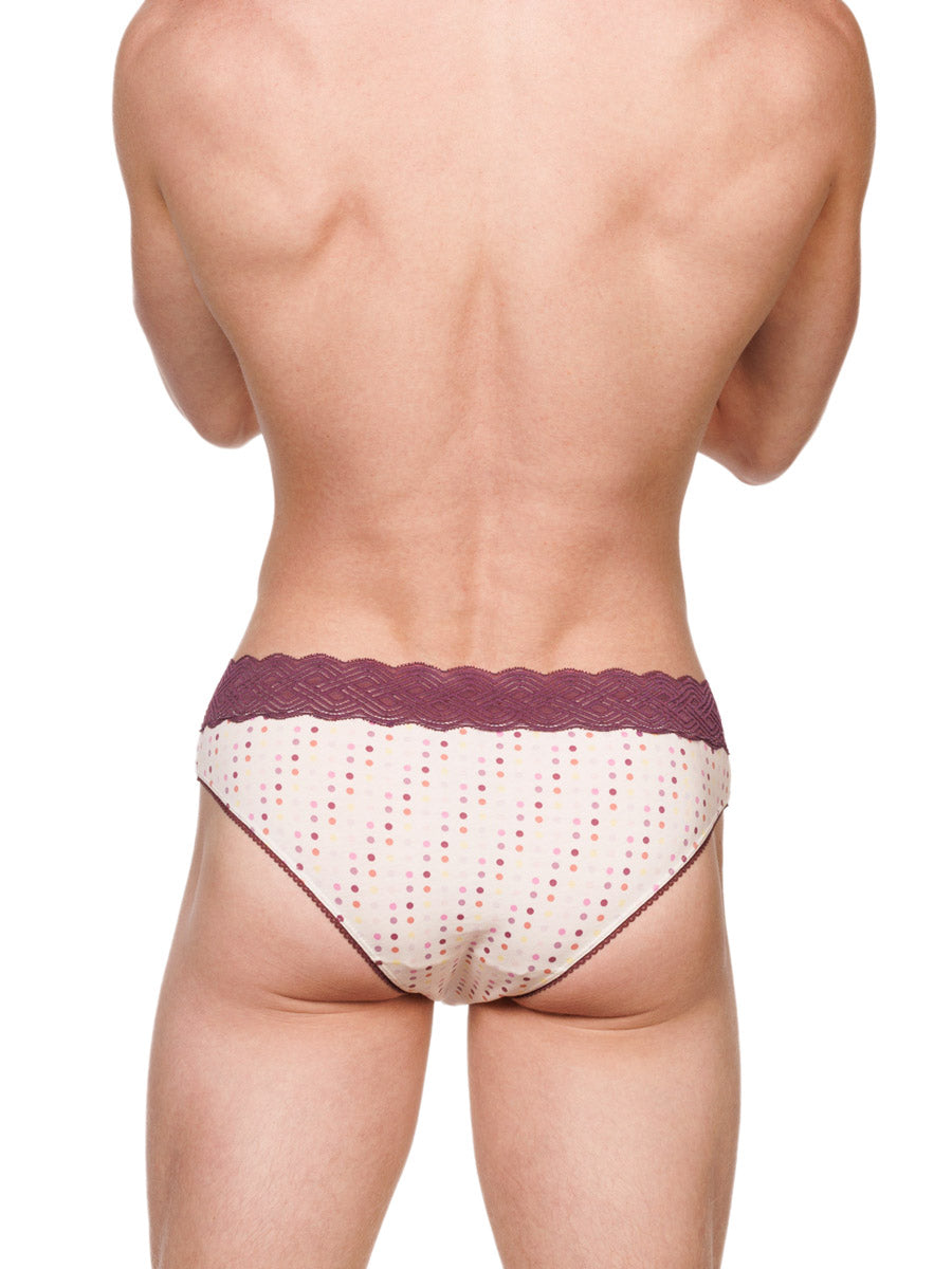 Back view of a male model wearing white XDress cotton panties with a red lace waistband