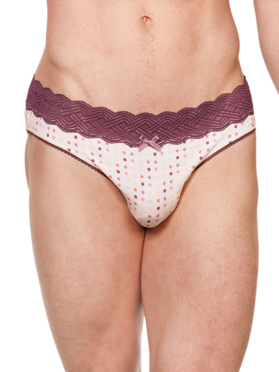 Closeup view of a male model wearing white XDress cotton panties with a red lace waistband