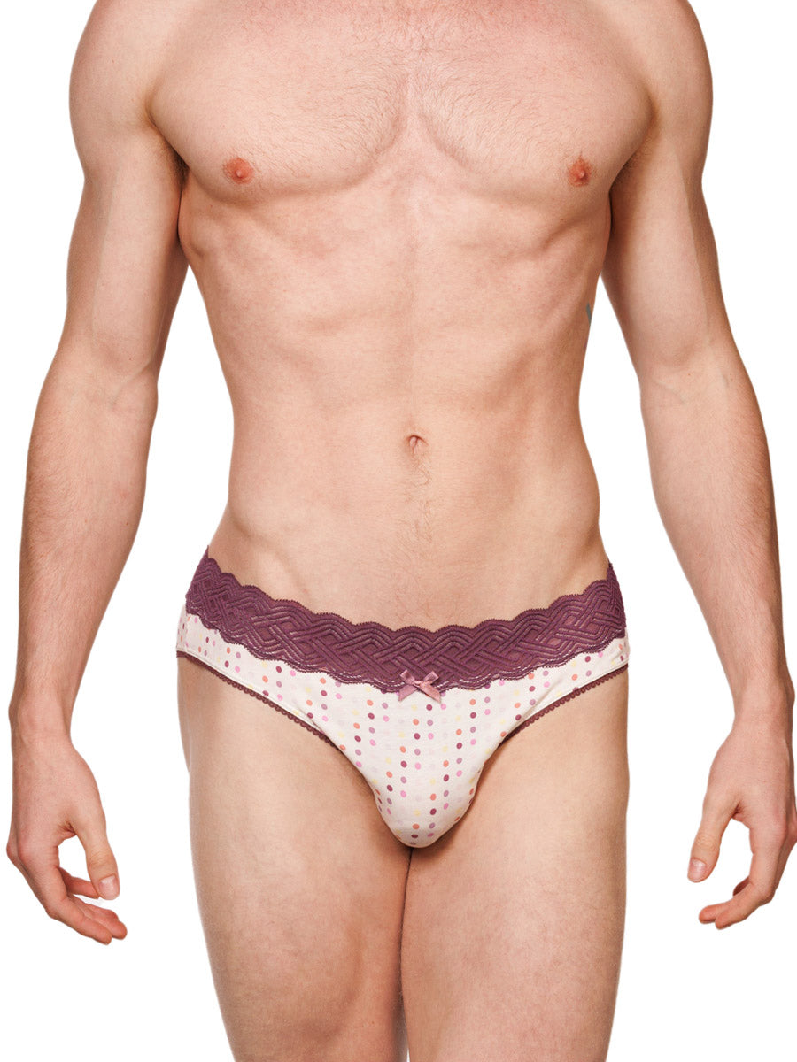 Front view of a male model wearing white XDress cotton panties with a red lace waistband