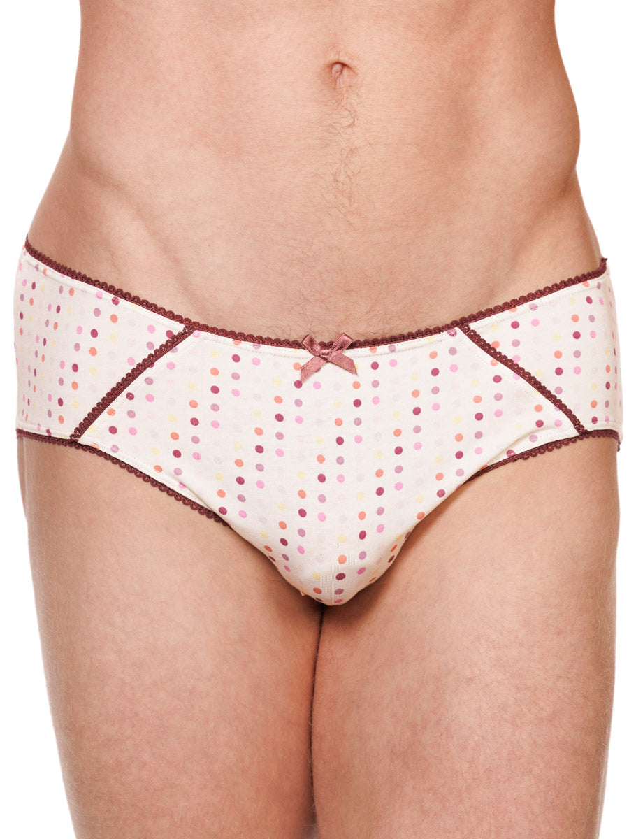 Closeup view of a male model wearing white XDress cotton panties with a polka dot pattern