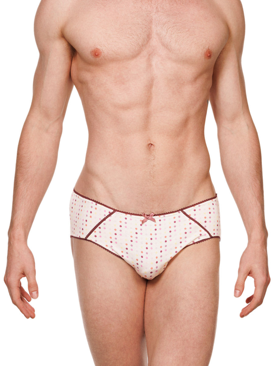 Front view of a male model wearing white XDress cotton panties with a polka dot pattern