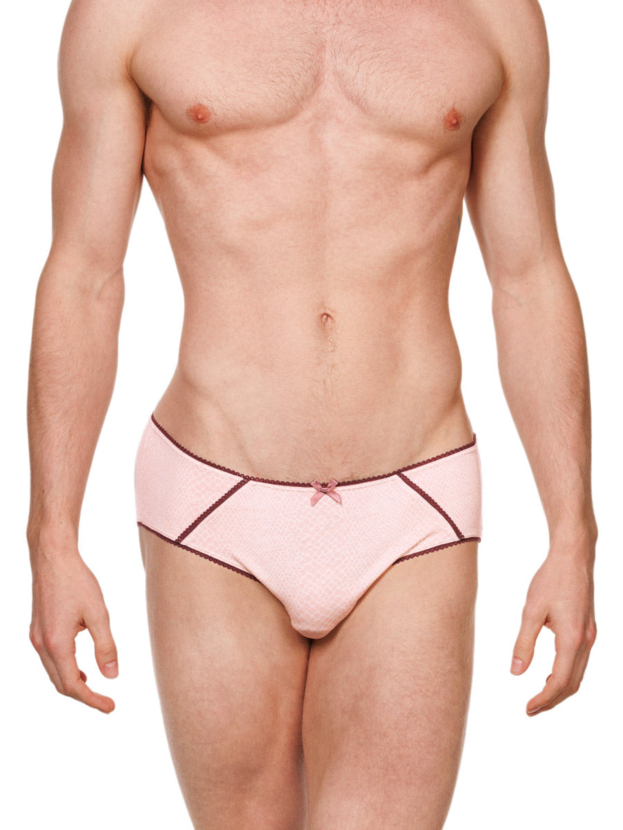 Front view of a male model wearing pink cotton XDress panties with red lace