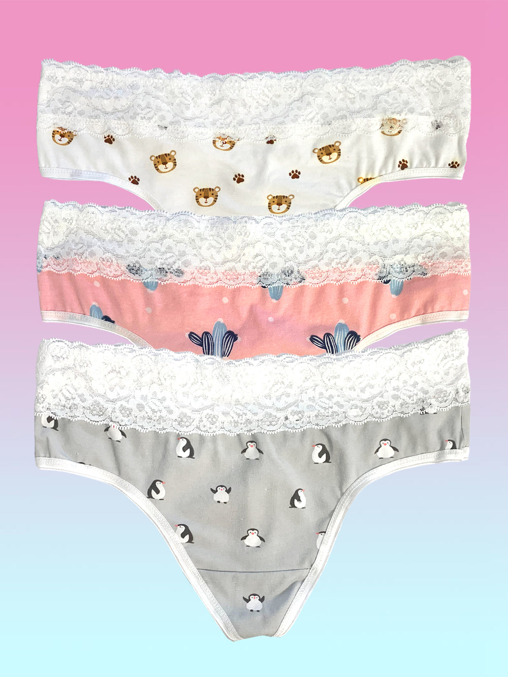 Flat lay image of three XDress panties with lace waistbands and animal prints