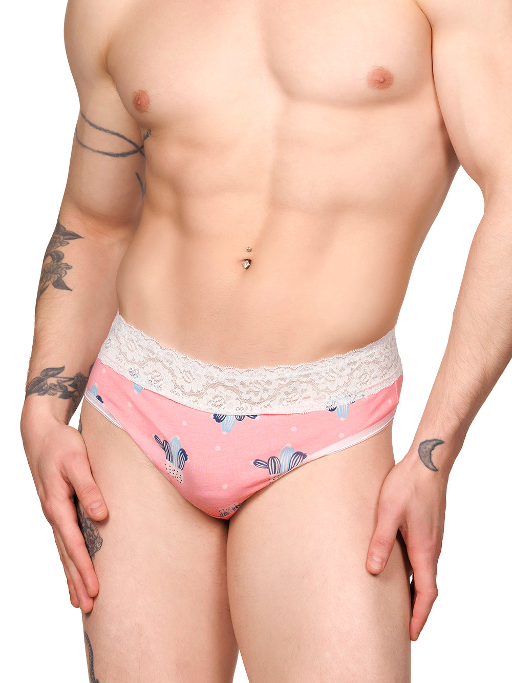 Front view of a male model wearing pink XDress panties with a white lace waistband and cactus print