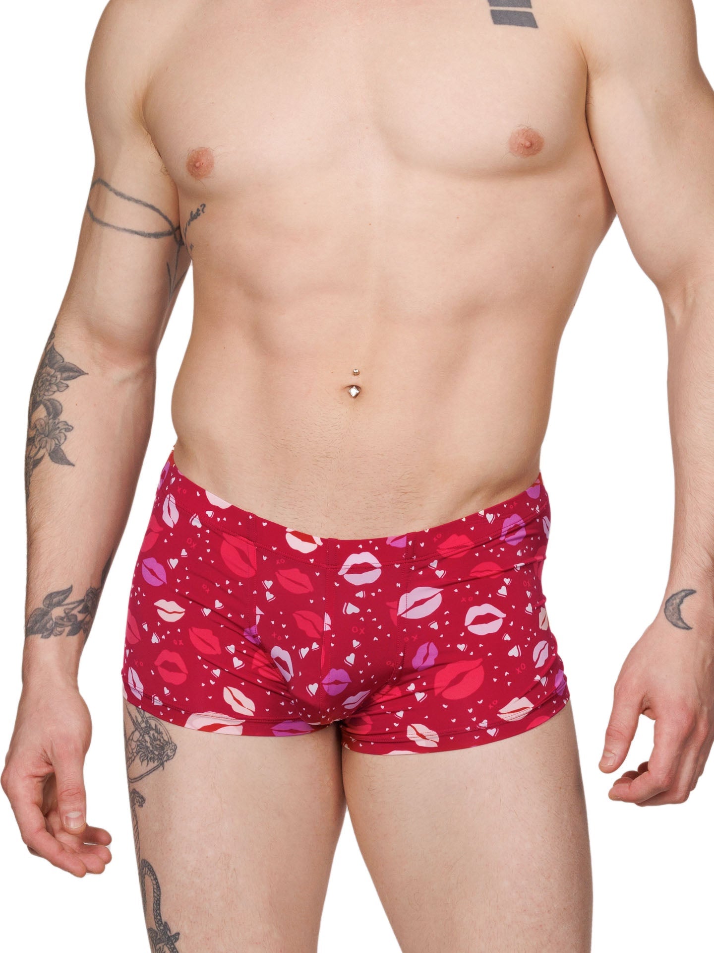 Front view of a male model wearing red XDress boxer shorts with a lipstick kiss pattern