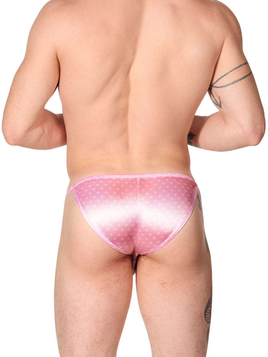 back view of a man wearing a pink satin XDress bikini