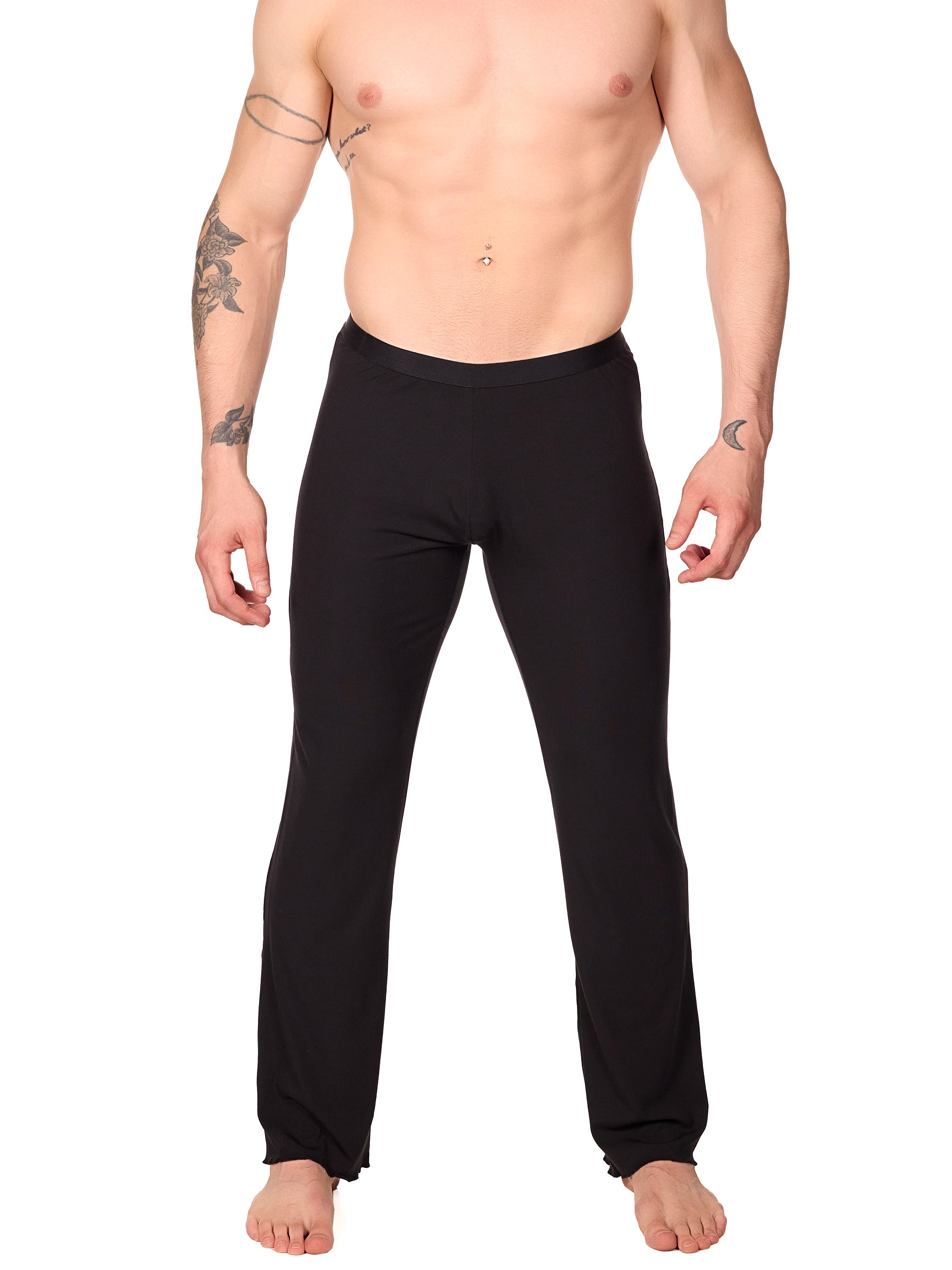 Front view of a man wearing black XDress lounge pants