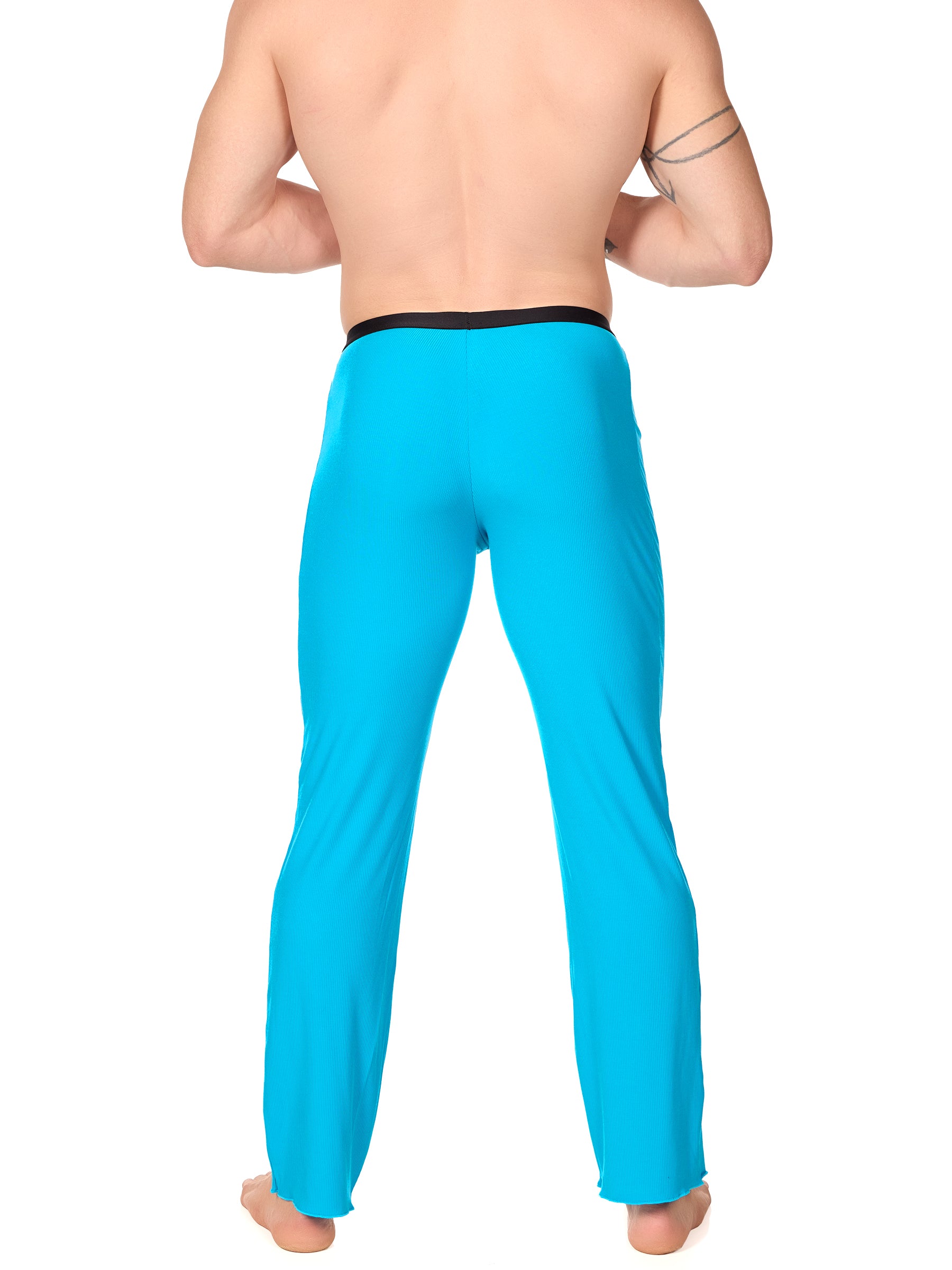 Back view of a man wearing turquoise XDress lounge pants with black waistband