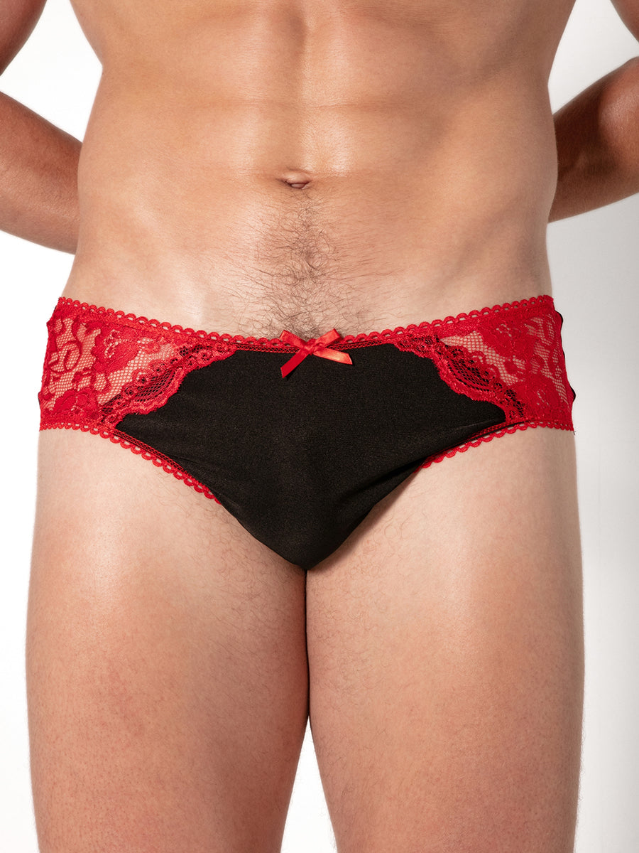 Red and black lace underwear on a plain background