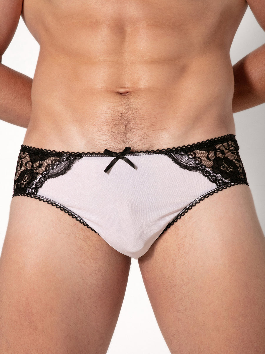 White men's underwear with black lace trim on a neutral background