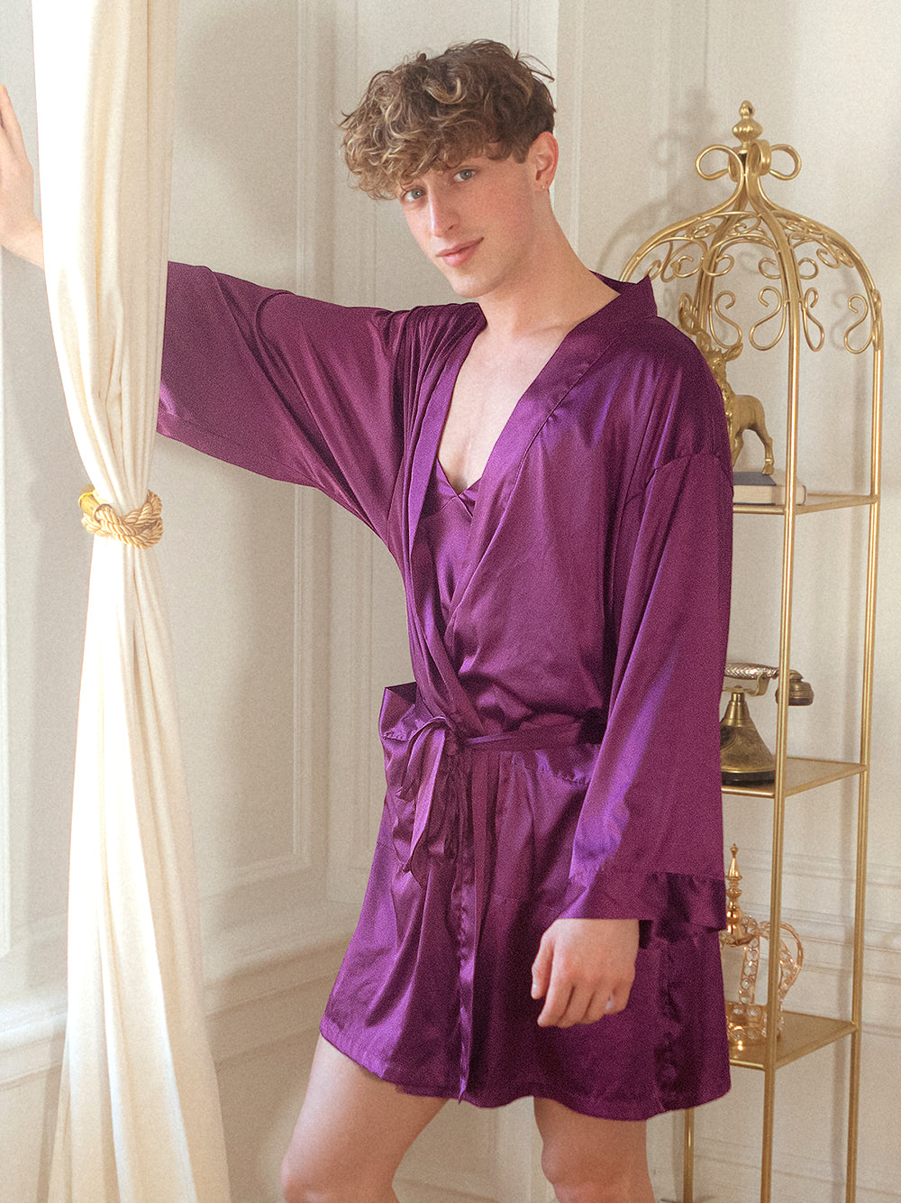 Front view of a male model wearing a purple XDress robe