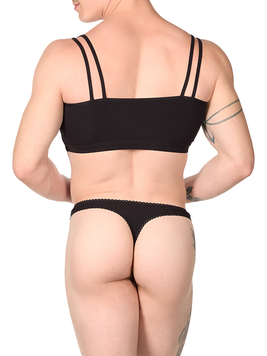 Back view of a man wearing a black XDress mini tank with matching thong