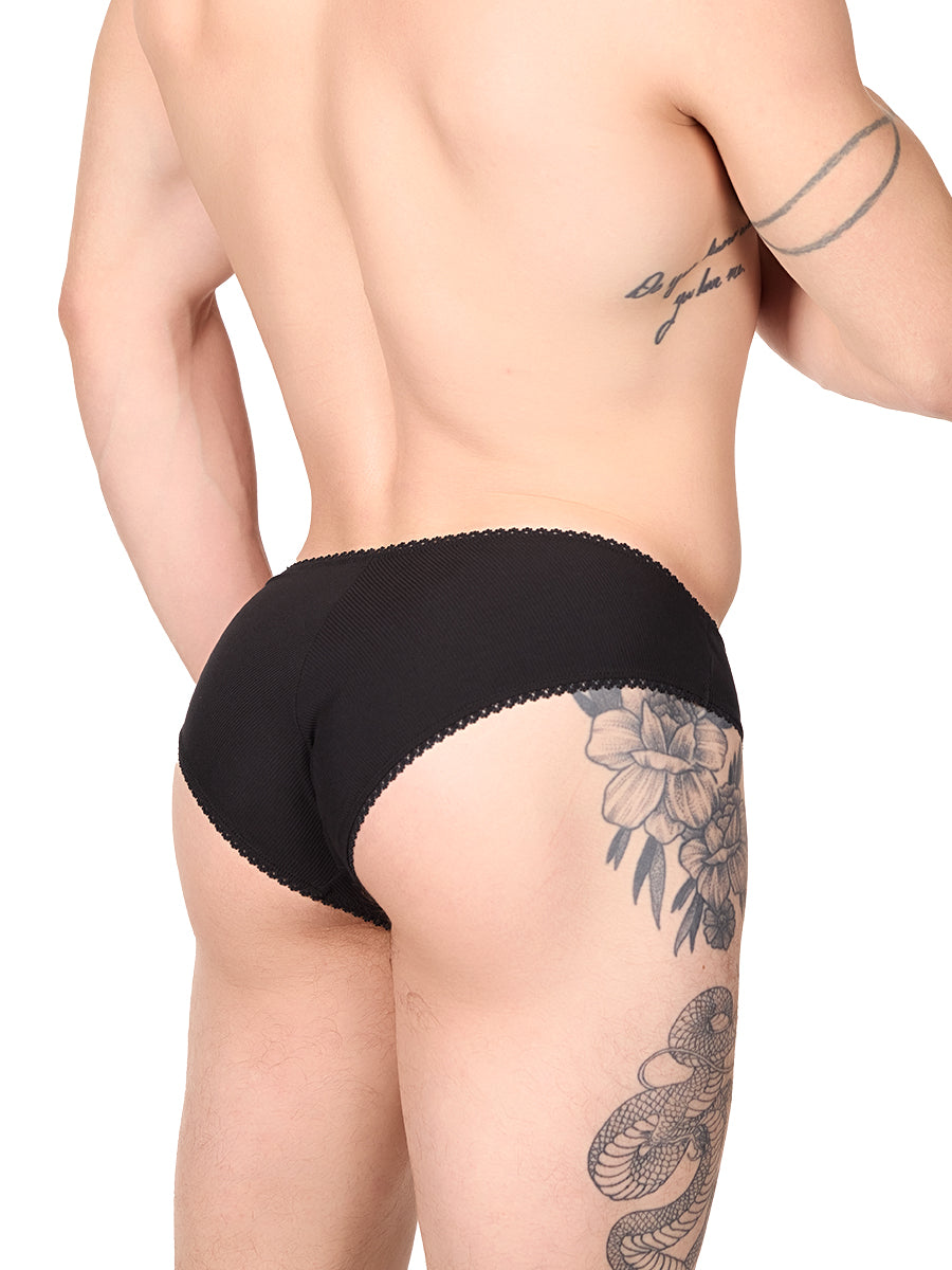 Side view of a man wearing a black XDress panty with lace trim