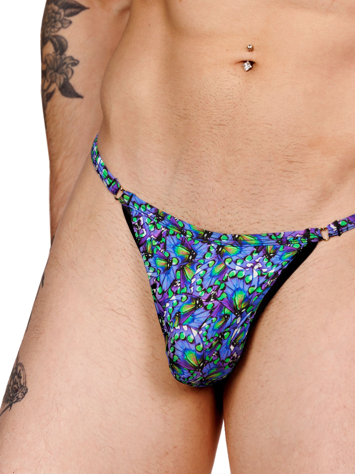 Closeup view of a blue floral print men’s thong with thin bikini straps and a smooth, contoured pouch.