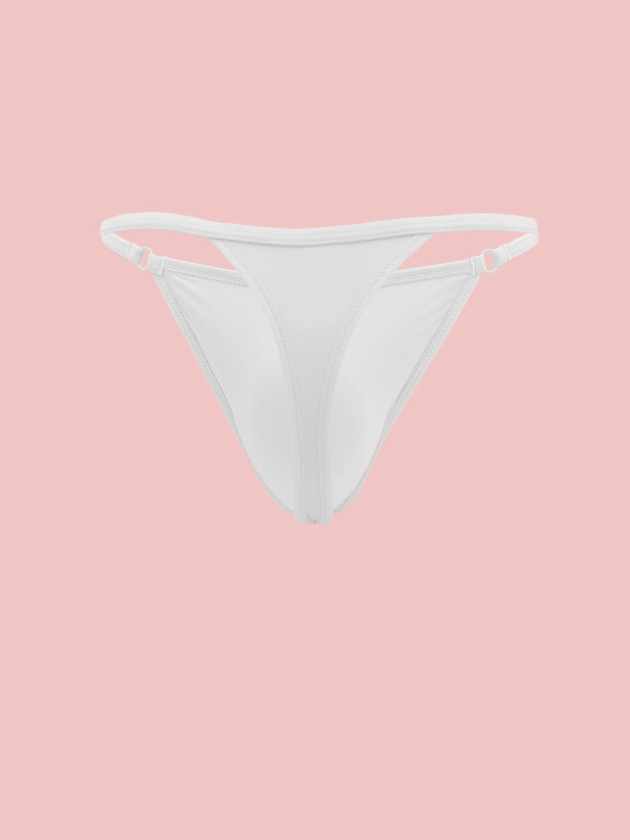 A white men's thong panty on a pink background.