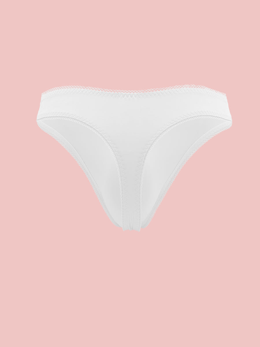 White thong panties for men with lace trim, on a pink background.