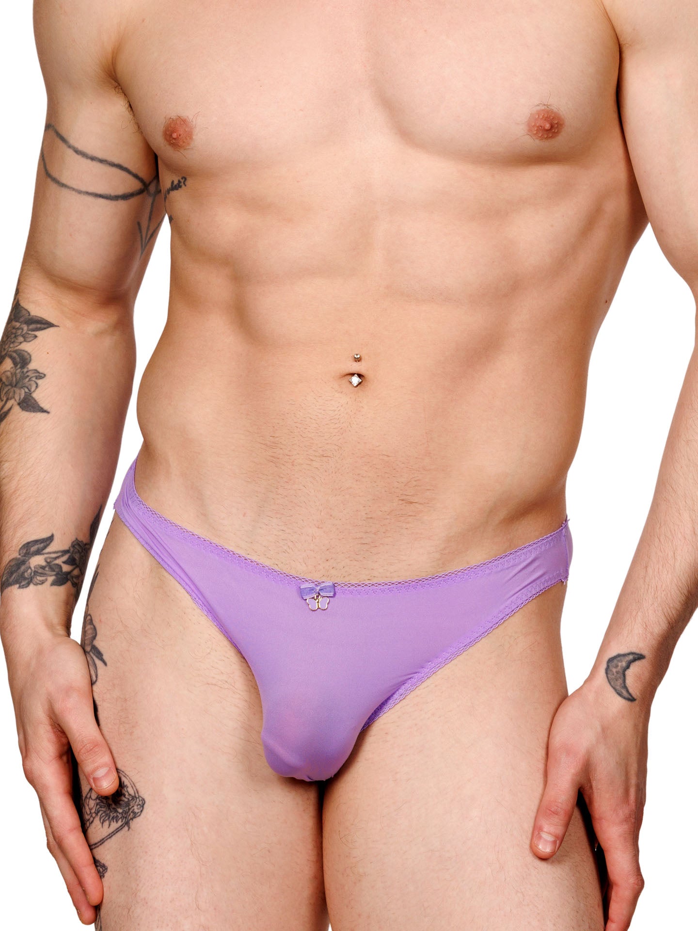 Male model wearing a purple men's panty with lace trim and a metallic charm at the front, shown from the front.