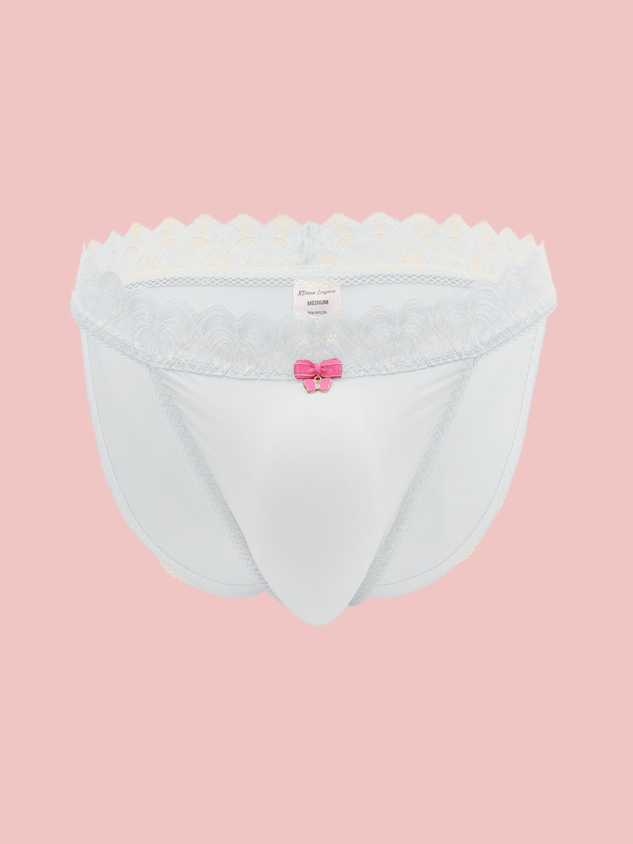 White men's panties with lace trim on a pink background.