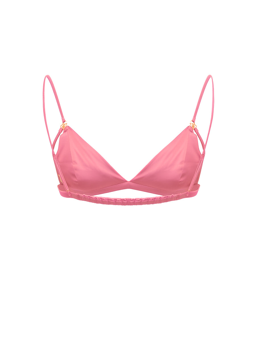 A pink satin men's bra on a white background.