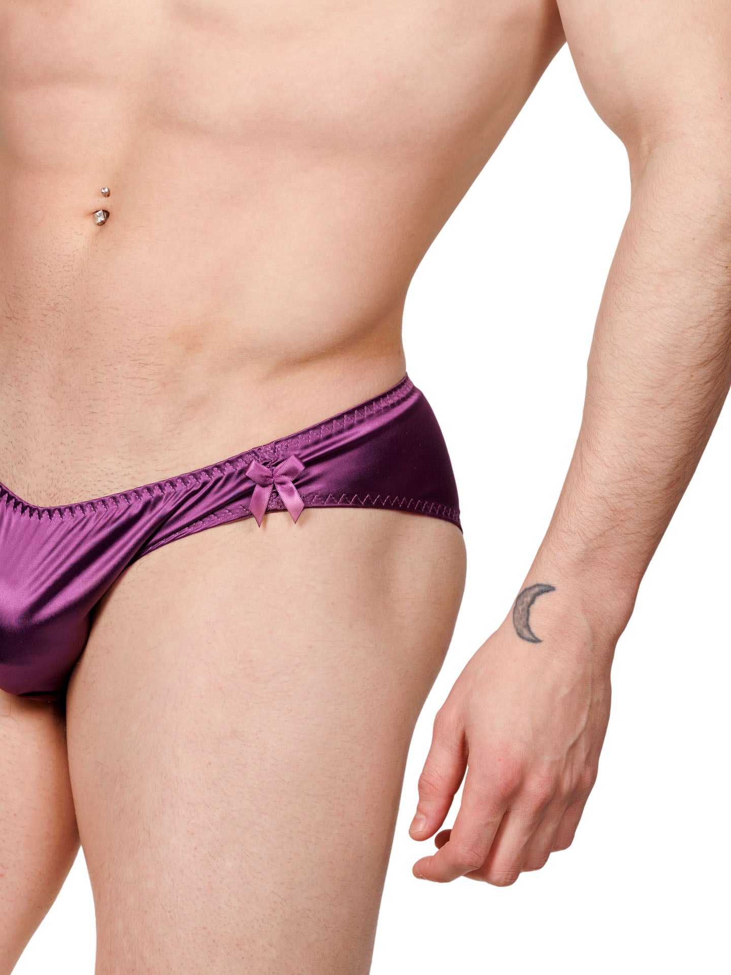 Closeup view of a male model wearing purple XDress panties with matching bow