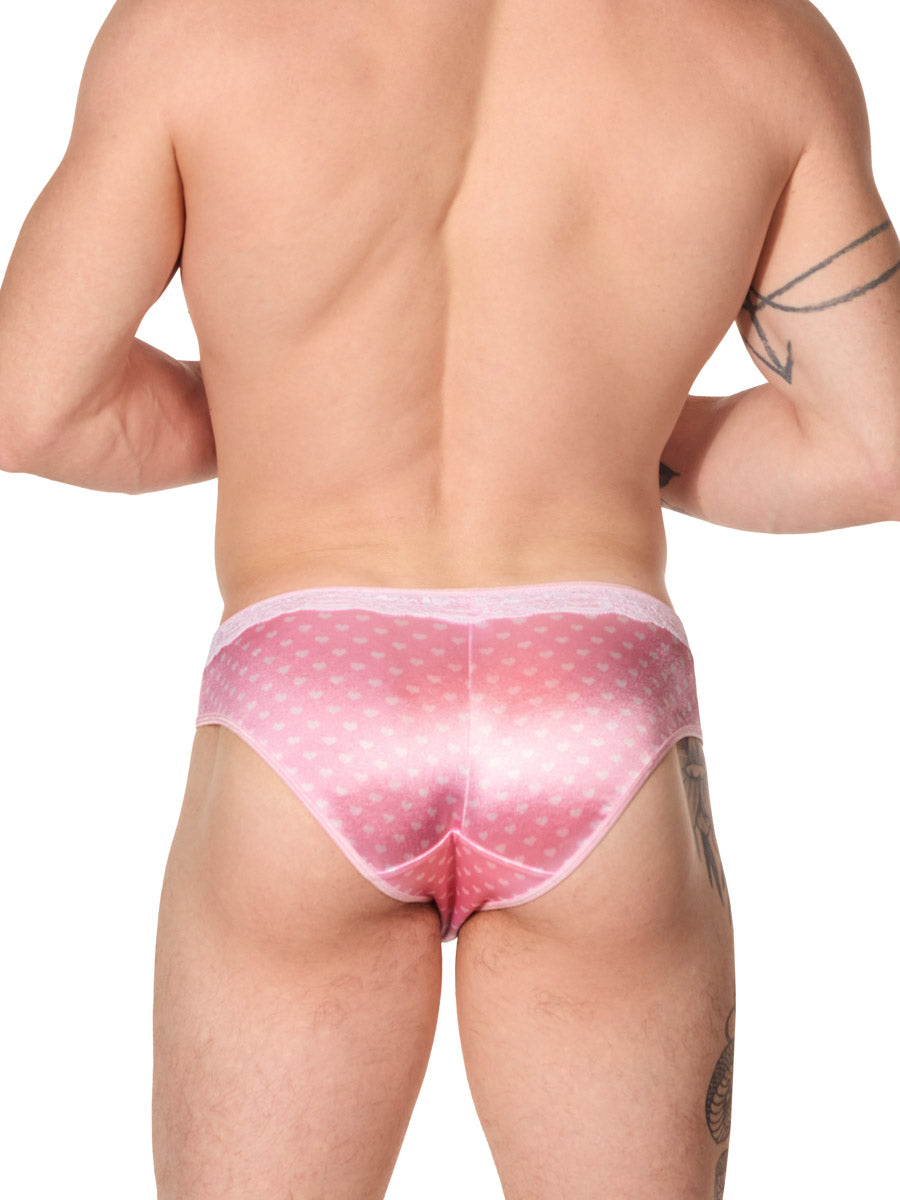 back view of a man wearing a light pink satin XDress panty 