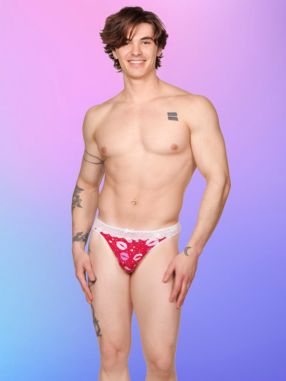 Front view of a male model wearing an XDress red and white thong with lipstick kisses pattern