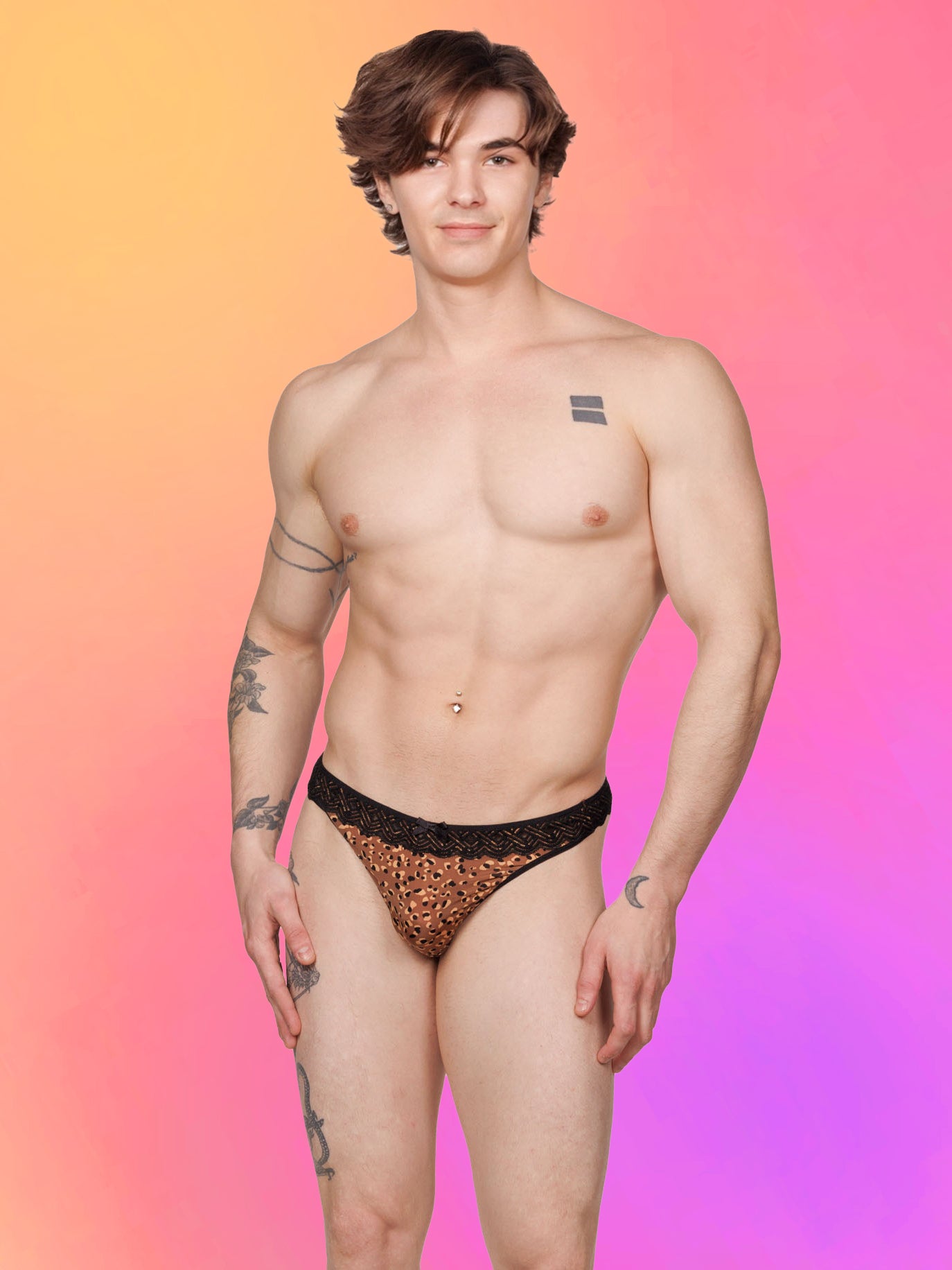 Front view of a male model wearing an XDress lace leopard print thong with ruffles