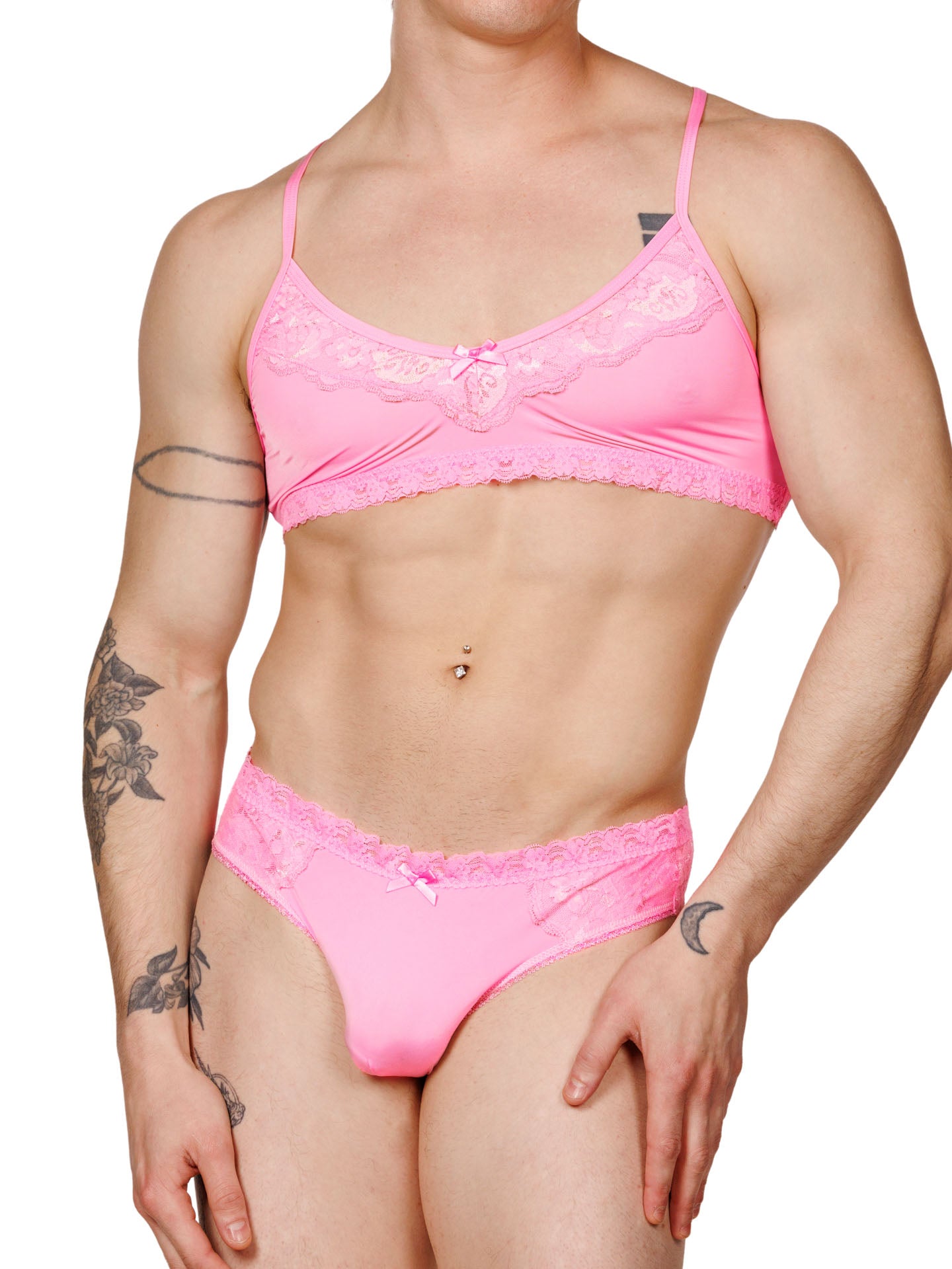 Front view of a male model wearing matching pink lace XDress bra and panties