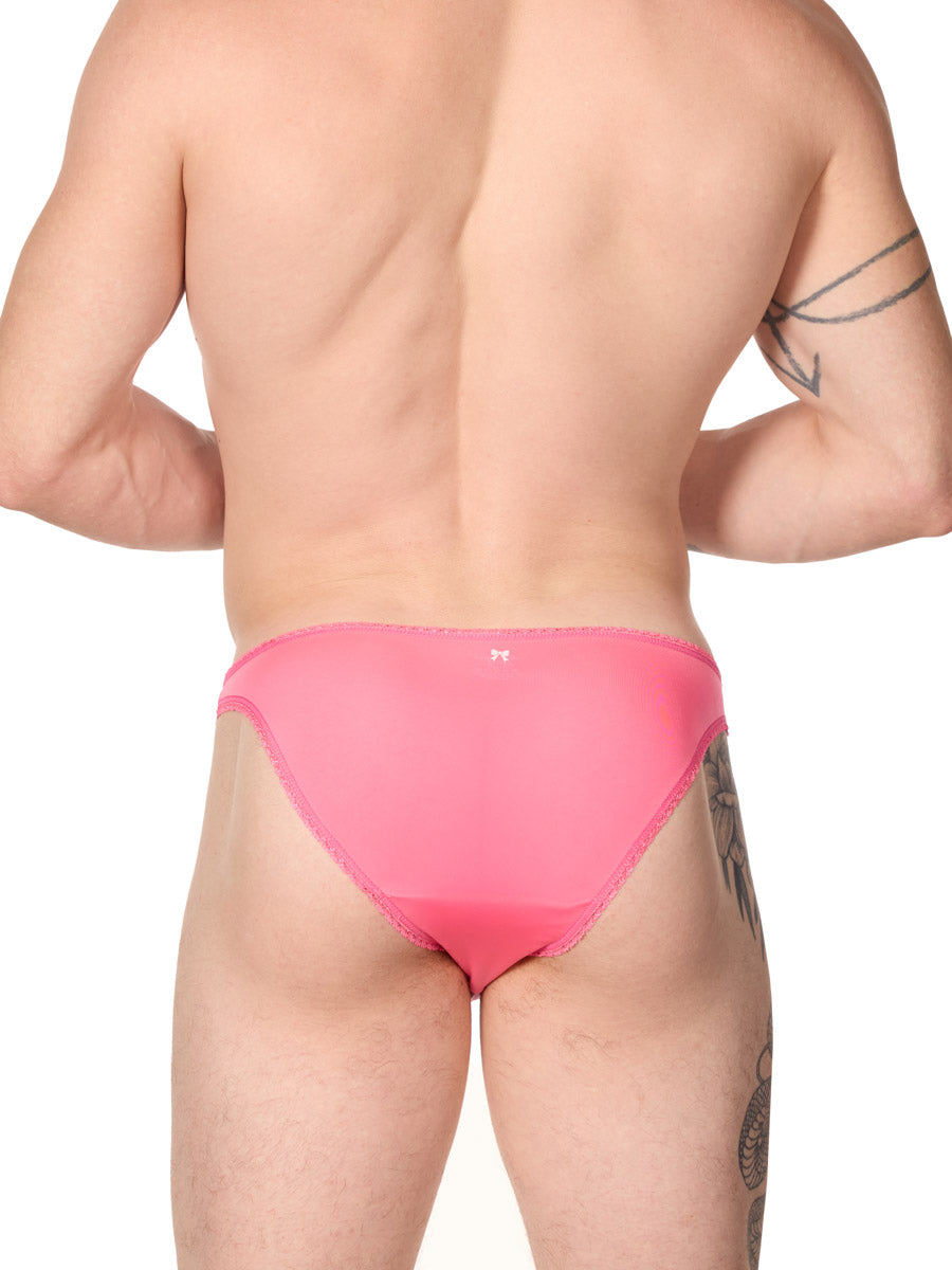 back view of man wearing an XDress pink bikini panty