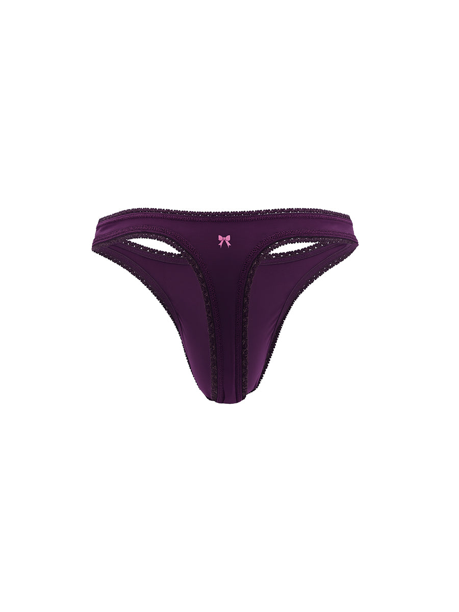 Purple thong with a small pink bow on a white background