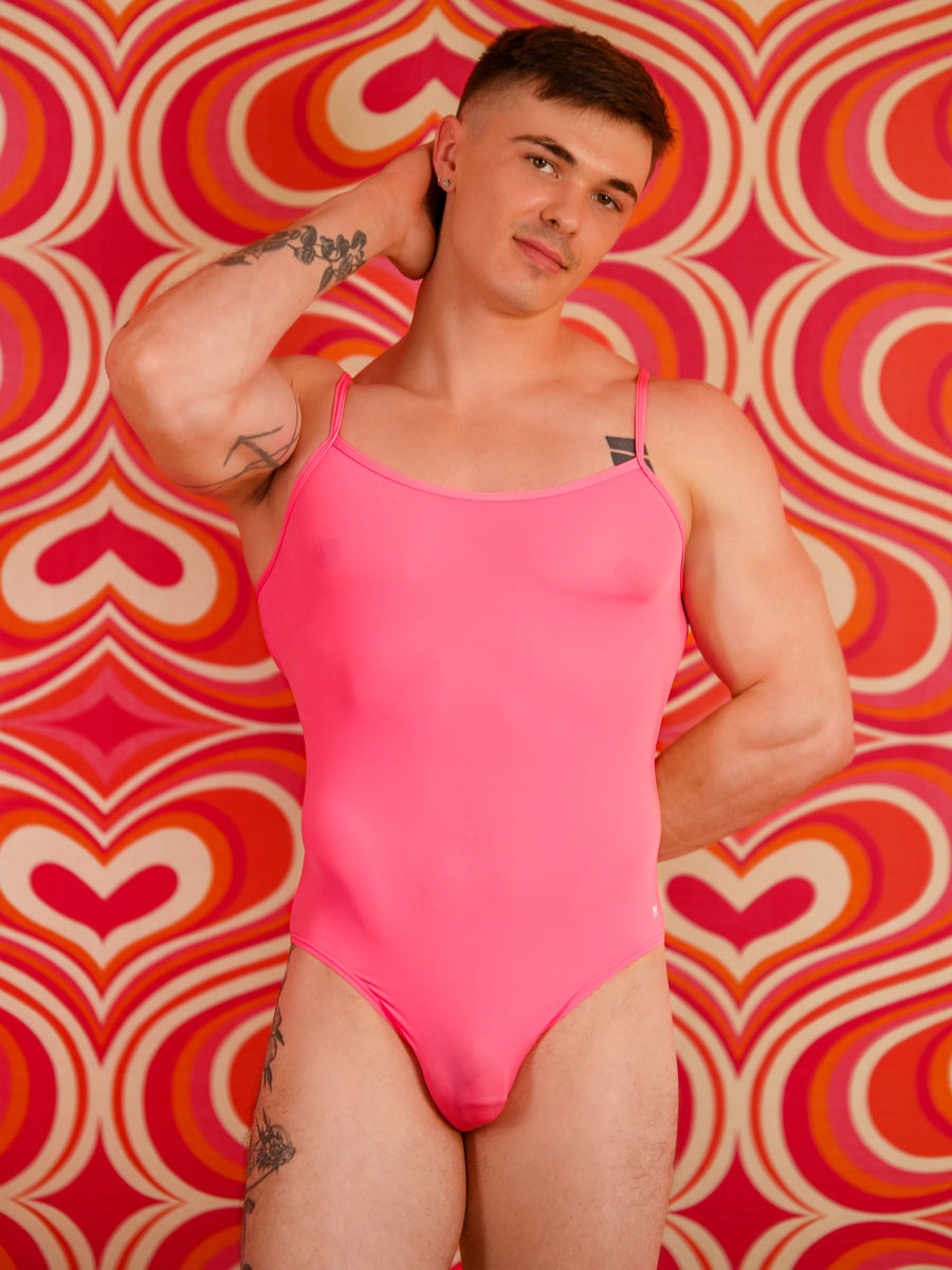 front view of man in an XDress pink one-piece bodysuit