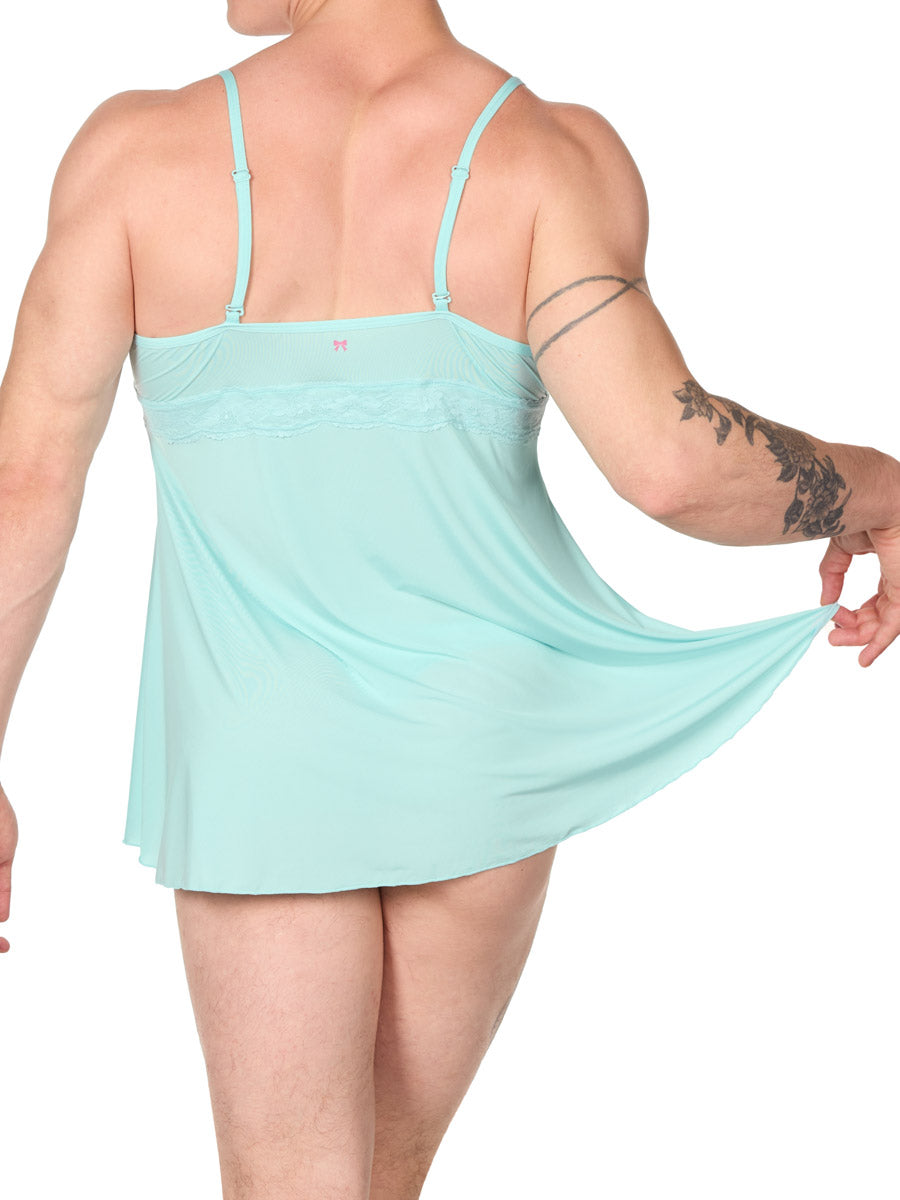 back view of man in an XDress light blue babydoll lingerie holding up the hem