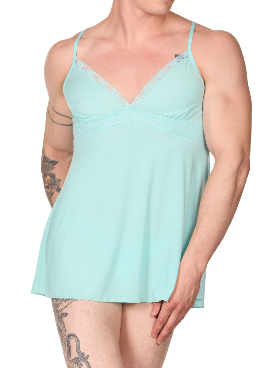 front view of man in an XDress light blue babydoll lingerie with hand on his thigh