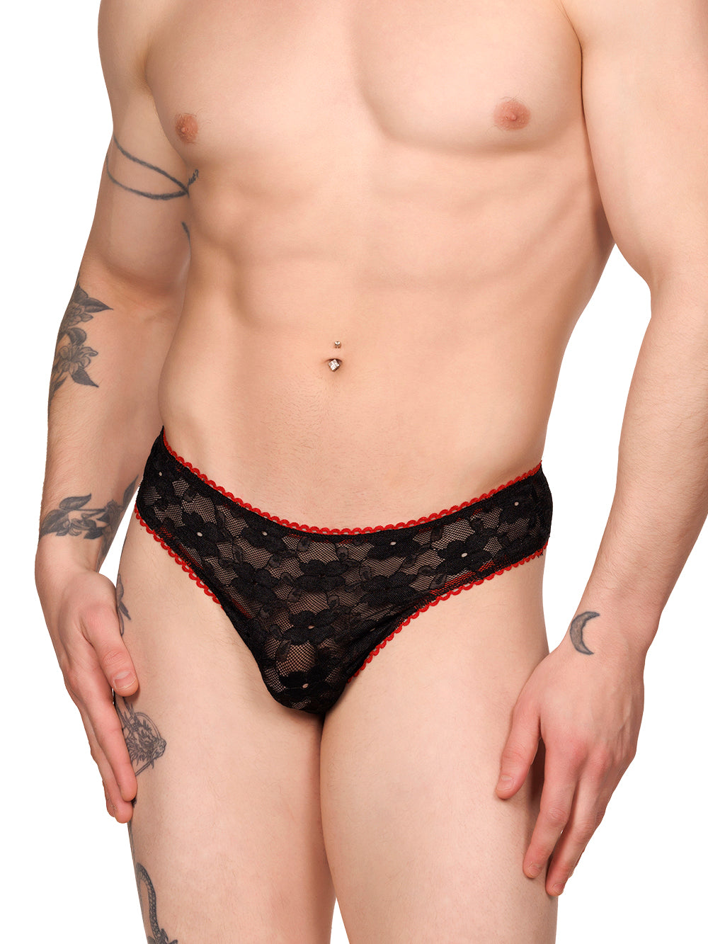 Front view of a male model wearing an XDress black lace thong with red picot trim