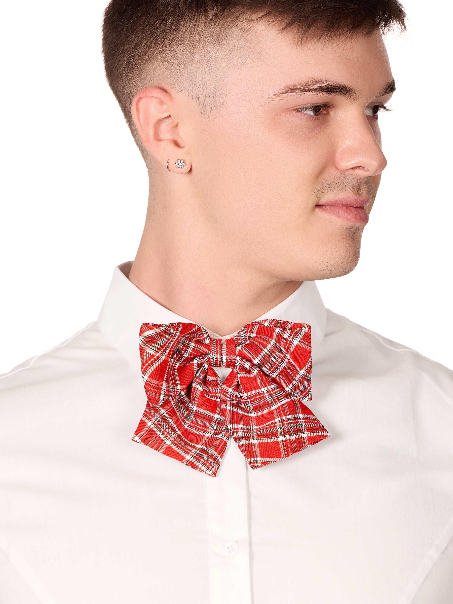 Closeup view of man wearing a red plaid bowtie and white blouse