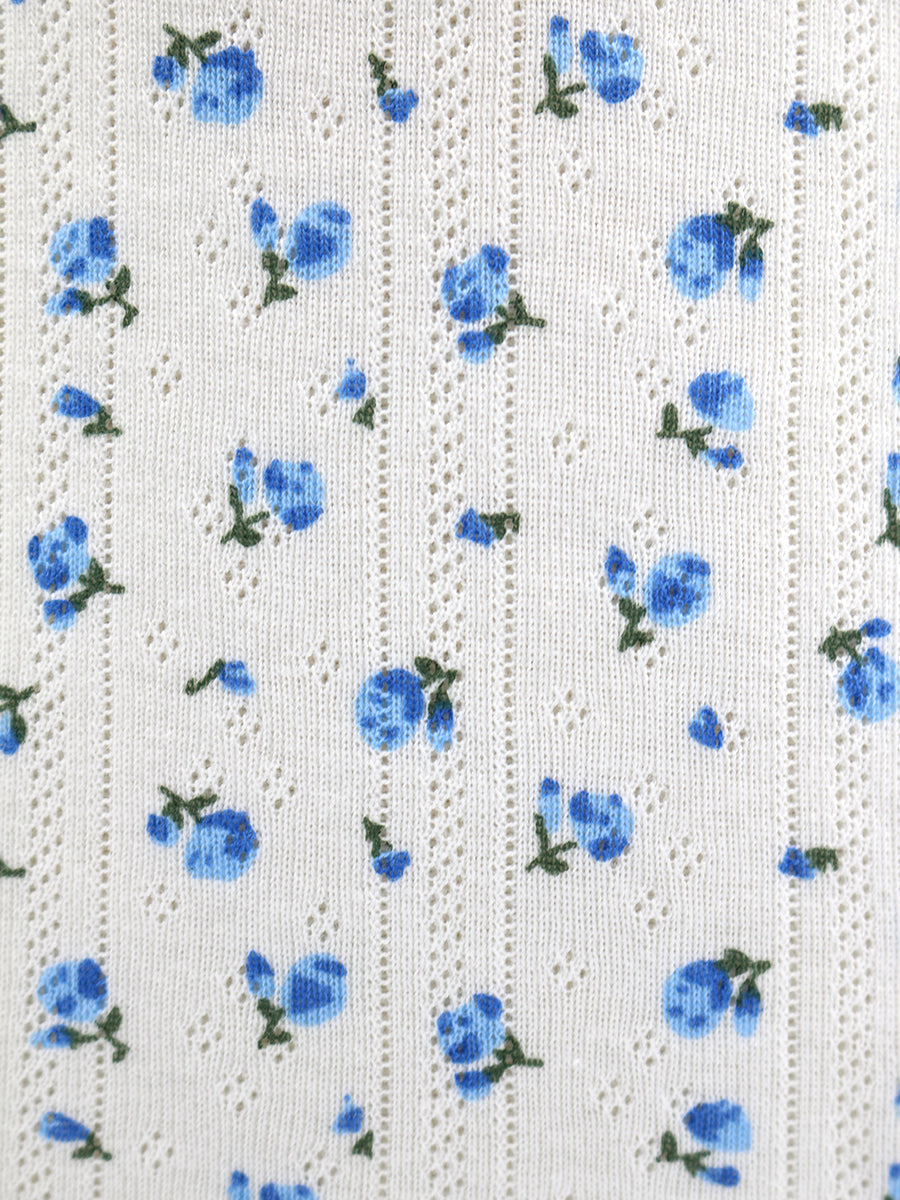 White fabric with blue floral pattern